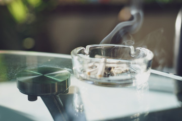 ashtray and cigarette on the table
