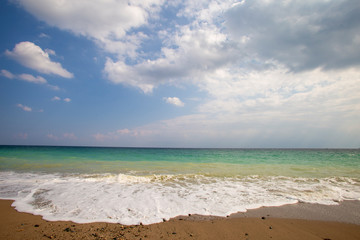 the wave rolling on the sand