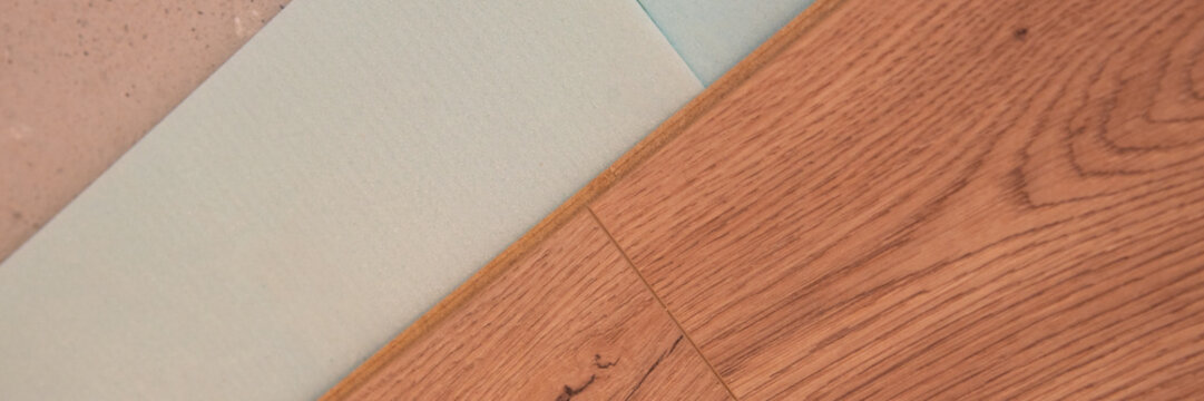 instaling floor laminate flooring with texture hardwood, top view.