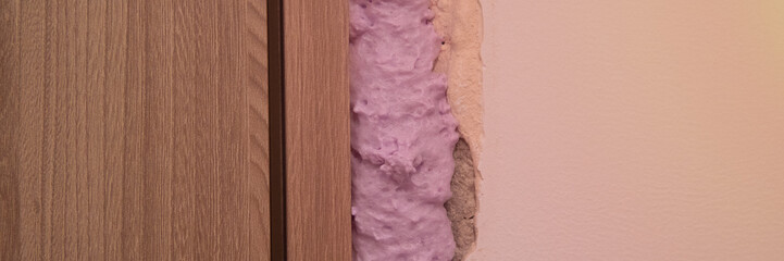 Installation of doors using polyurethane foam mounting