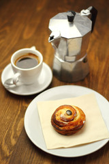 Coffee Cup and Bread Roll. Continental Breakfast.