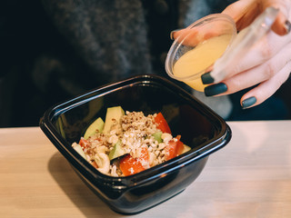 Quinoa Salad with pepper, avocado, nuts and mango sauce
