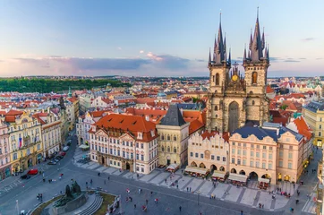 Fototapeten Prag Top aerial view of Prague Old Town Square (Stare Mesto) historical city centre. Former market square. Stone Bell House, Gothic Church of Our Lady before Tyn, evening view. Bohemia, Czech Republic  © Aliaksandr