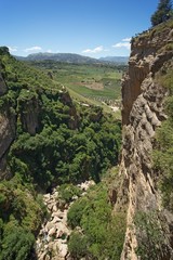 View from Ponte Nuevo (the New Bridge) in Ronda, Spain. This bridge spans the 120-metre-deep (390 ft) chasm that carries the Guadalevín River and divides the city of Ronda