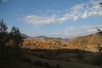 Naklejka premium Colorful autumn landscape in the mountain village. 