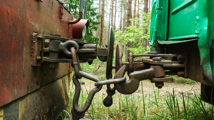 Top view of the hitch between two railways wagon. Business concept.