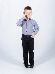 Modern gadget. Small businessman. Upbringing and development. Little boy formal clothes call mobile phone. Cute boy hold smartphone. Mobile conversation. Business school. Mobile communication