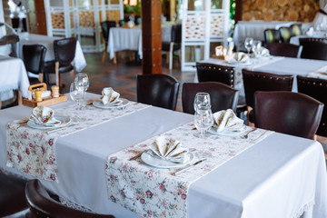 Table setting in restaurant.