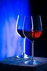 Two glasses of red wine. Intimate atmosphere. Romance concept