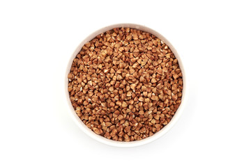 Buckwheat groats in a bowl, isolated on white background