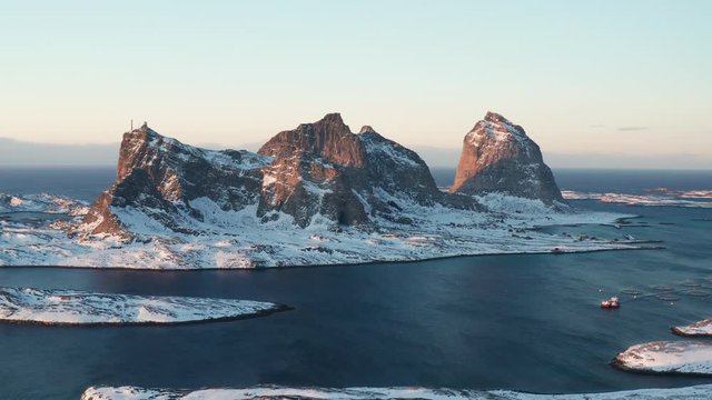 Winter in Tr&aelig;na, iconic mountains of Sanna island, Nordland, Northern Norway, aerial drone shot