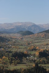 Fototapeta premium Colorful autumn landscape in the mountain village. 