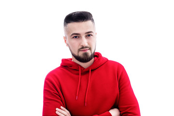 Obraz premium Handsome man in red casual clothes posing with arms crossed on white background