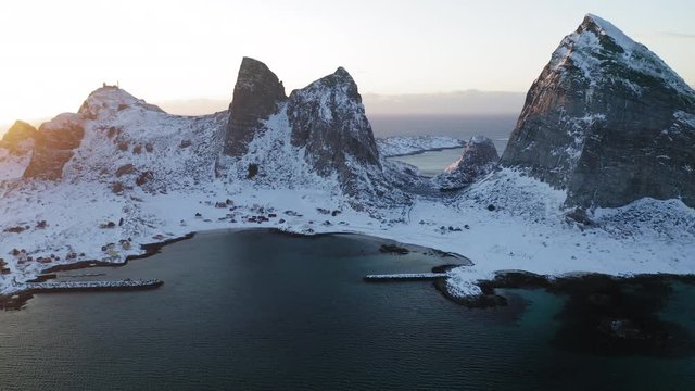Winter sunset in Tr&aelig;na, iconic mountains of Sanna island, Nordland, Northern Norway, aerial drone shot