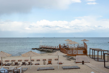 The empty beach. Bad weather at sea or ocean.