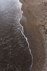 Fototapeta na wymiar Sea wave cuts the coast. Yin Yang