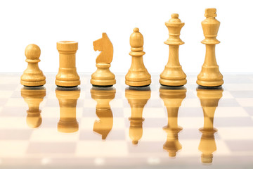 White chess pieces on a chessboard in ascending order. Career growth concept