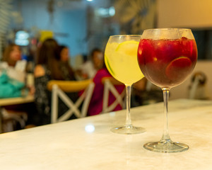 bar table with two cups and unfocused background