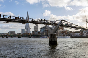 View of the south bank of river Thames with the Millennium Bridge in the foreground