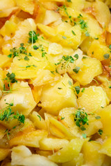 Fried potatoes texture with herbs, vertical image