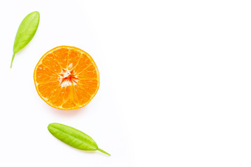 Fresh orange citrus fruit with leaves on white background.