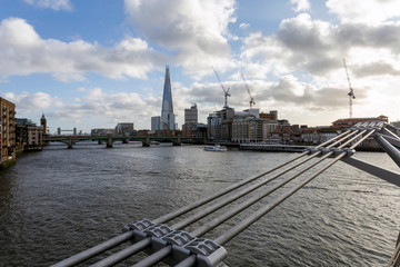 View of the south bank of river Thames with the Millennium Bridge in the foreground