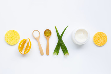 Natural ingredients for homemade skin care on white.