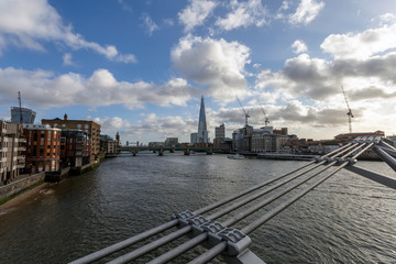 Naklejka premium View of the south bank of river Thames with the Millennium Bridge in the foreground