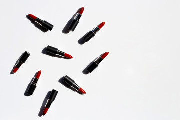 Flat lay composition, Lipsticks on white background with shadow. Beautiful Make-up concept