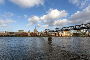 View of the city of London with the river Thames and the Millennium Bridge in the foreground