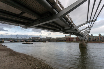 View of the city of London with the river Thames and the Millennium Bridge in the foreground
