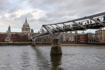 Fototapeta na wymiar View of the city of London with the river Thames and the Millennium Bridge in the foreground
