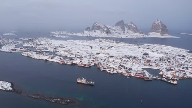 Winter in Tr&aelig;na islands and fishing vessel, Nordland, Northern Norway, aerial drone shot