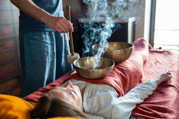 Tibetan singing bowls in sound therapy in spa center