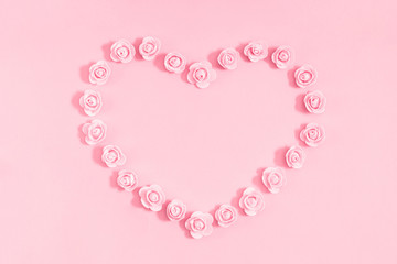 Elegant flowers composition for Valentine's day. Pink flowers on pastel pink background. Valentines Day, Happy Women's Day, Mother's day concept. Flat lay, top view, copy space