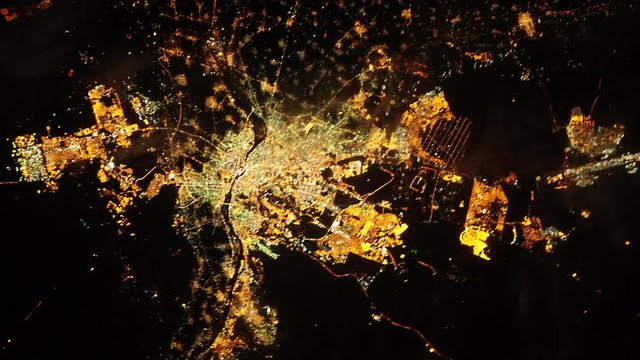 Cairo Egypt city satellite view by night with animated changing colors, aerial zoom out. Contains public domain image by Nasa