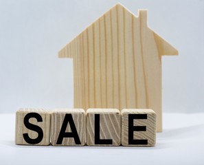 word sale on cubes and wooden house