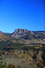 Mountain forest village in autumn. Autumn mountain village view