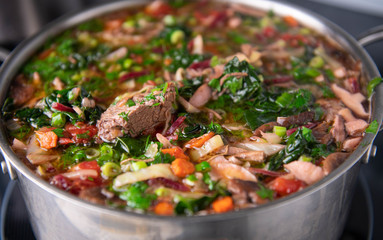 Close up of Home Made Borscht Soup Being Cooked in Stainless Steel Pot