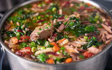 Close up of Home Made Borscht Soup Being Cooked in Stainless Steel Pot