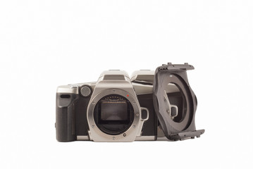 35 mm analog camera on a white background. Film camera.