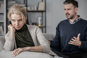 Fototapeta premium Wife giving husband the silent treatment during marriage fight