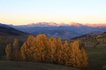 Mountain forest village in autumn. Autumn mountain village view