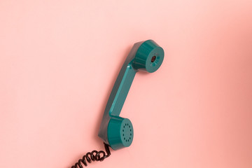 vintage style telephone on pink background