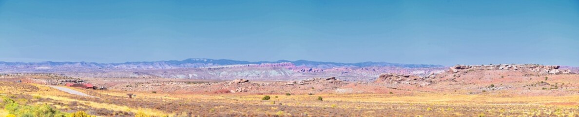 Looking back towards Moab Panorama views of desert mountain ranges along Highway 191 in Utah in fall. Scenic nature near Canyonlands and Arches  National Park. United States of America. USA.
