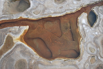 stone and sand in water