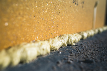 DIY concept. Construction PU - poly urethane foam. The window is installed using a mounting foam. Installation foam