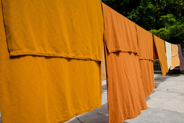 Monk robes hang to dry out front of a sacred temple