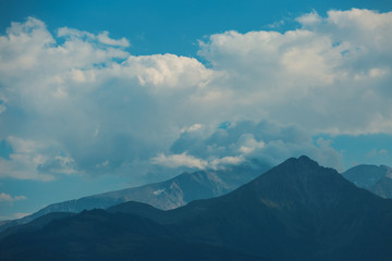Beautiful view of spring landscape on the mountains and peaks in the snow in the Alps. Austria