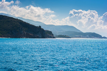 Naklejka na ściany i meble Idyllic image of peaceful sea and mountains in blue gradient color.